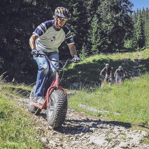 Man enjoys unique downhill fun with a monster scooter at Madrisa. | © Davos Klosters Mountains